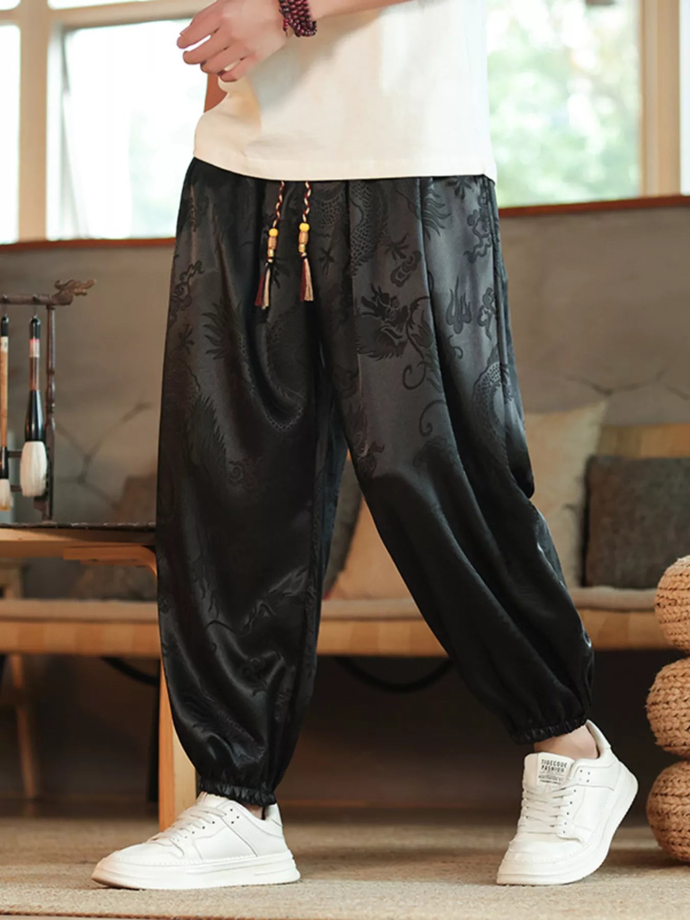 Dynamic shot of the URBAN UNIT Dynasty Silhouette Jacquard Harem Pants in Midnight Black, built for the grind and maximum urban resilience.