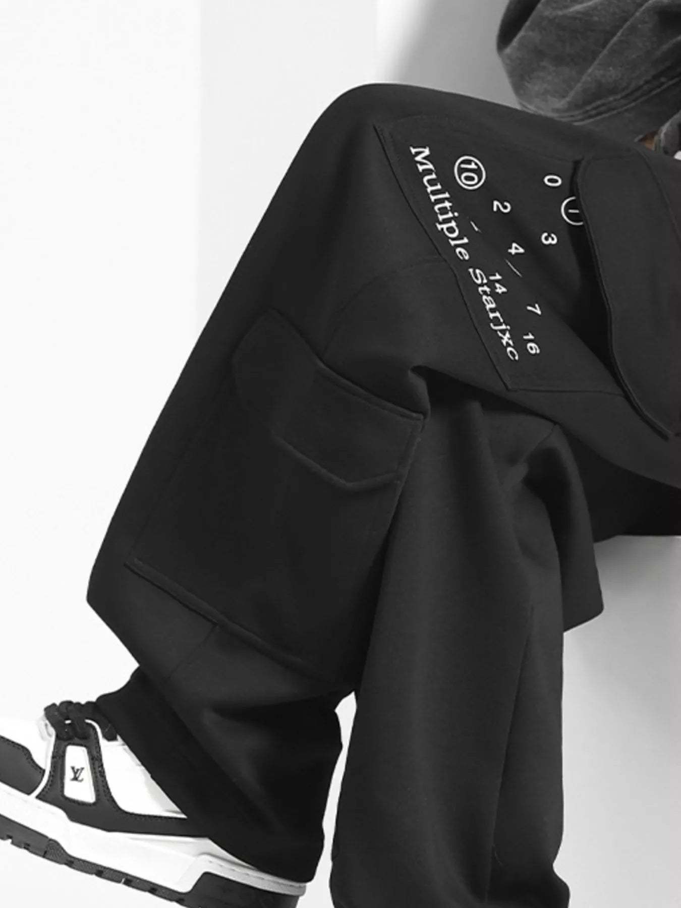 URBAN UNIT Multiple Star Loose Fit Cargo Pants in Midnight Black - Pocket and Graphic Detail