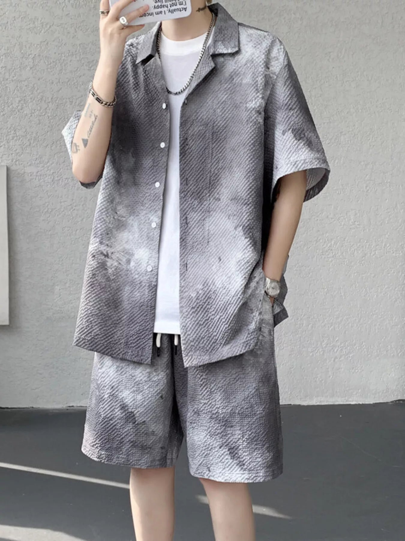 URBAN UNIT Corrosion Tie-Dye Set in Concrete Ash. A raw, desaturated grey gradient on a structured two-piece set. Find your freedom in the urban jungle.