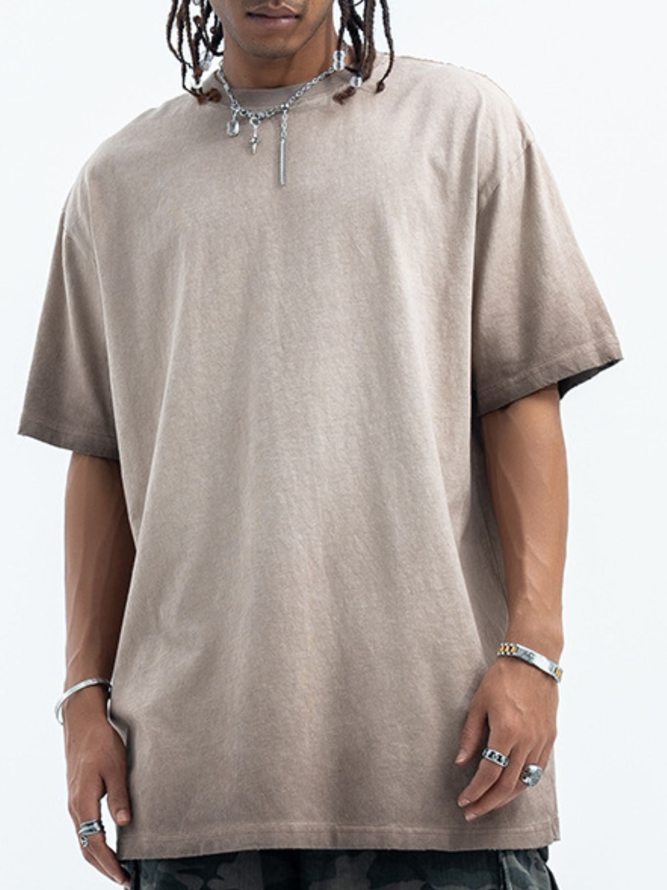 Model styling the URBAN UNIT Essential Vintage Wash Tee in Concrete Sand, a premium oversized beige t-shirt built for the urban grind.
