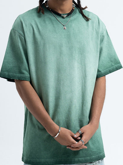 Model wearing the URBAN UNIT Essential Vintage Wash Tee in Industrial Sage, showcasing the oversized streetwear fit and dropped shoulders.