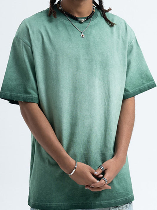 Model wearing the URBAN UNIT Essential Vintage Wash Tee in Industrial Sage, showcasing the oversized streetwear fit and dropped shoulders.