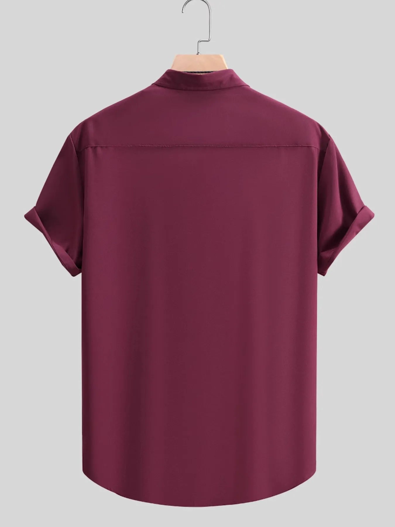 Back view of the URBAN UNIT Foundation Short Sleeve Shirt in Oxblood Red. Demonstrating the structured, oversized fit and crisp silhouette essential for modern streetwear aesthetics.