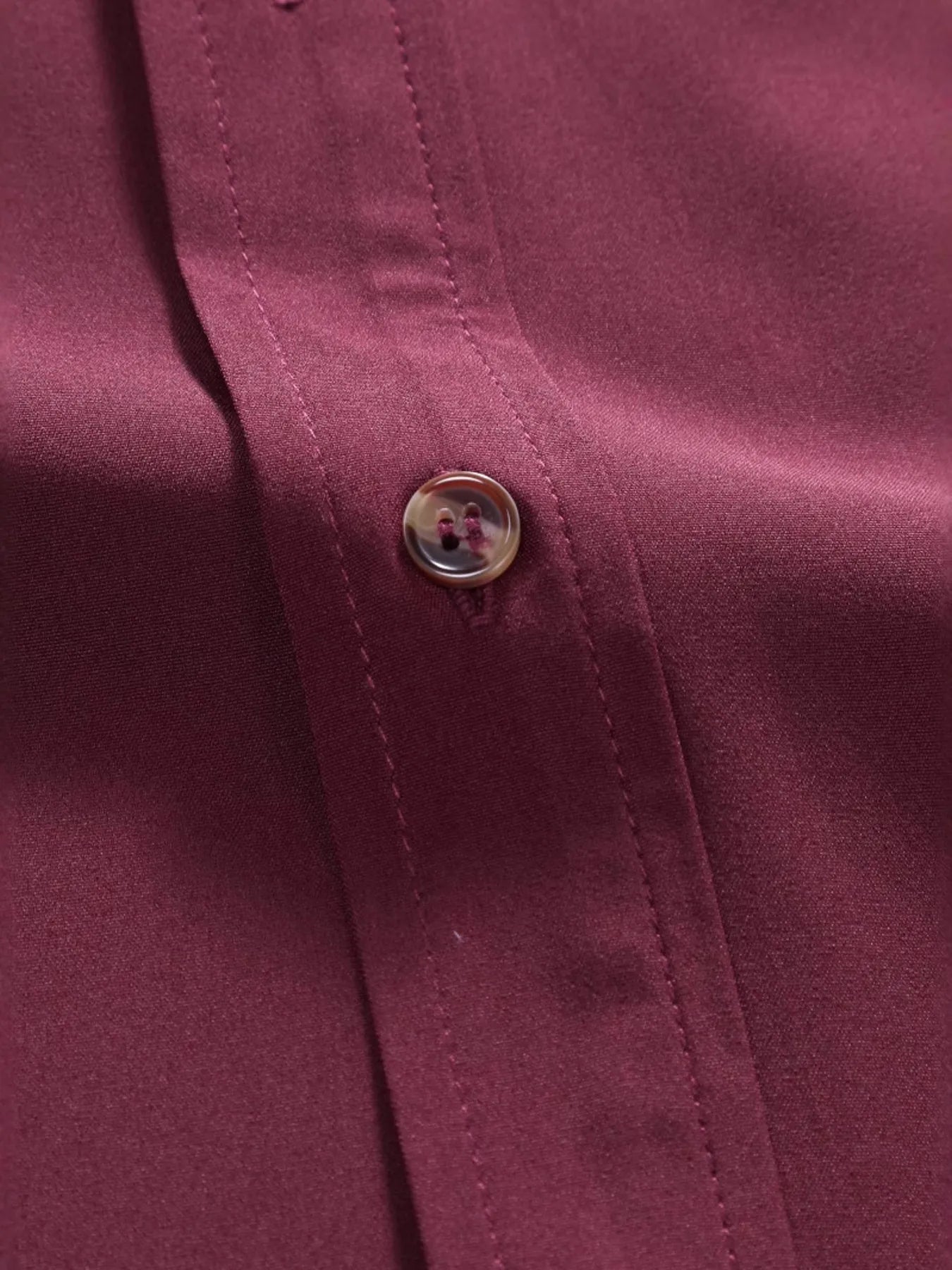 Close-up of the premium button detailing on the URBAN UNIT Foundation Short Sleeve Shirt. Highlighting the durable fabric and heavy-duty stitching built for resilience.