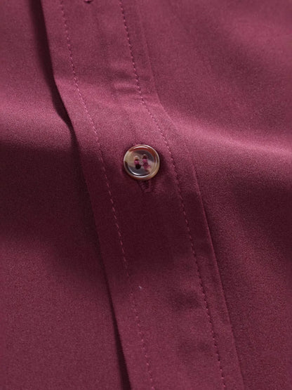 Close-up of the premium button detailing on the URBAN UNIT Foundation Short Sleeve Shirt. Highlighting the durable fabric and heavy-duty stitching built for resilience.