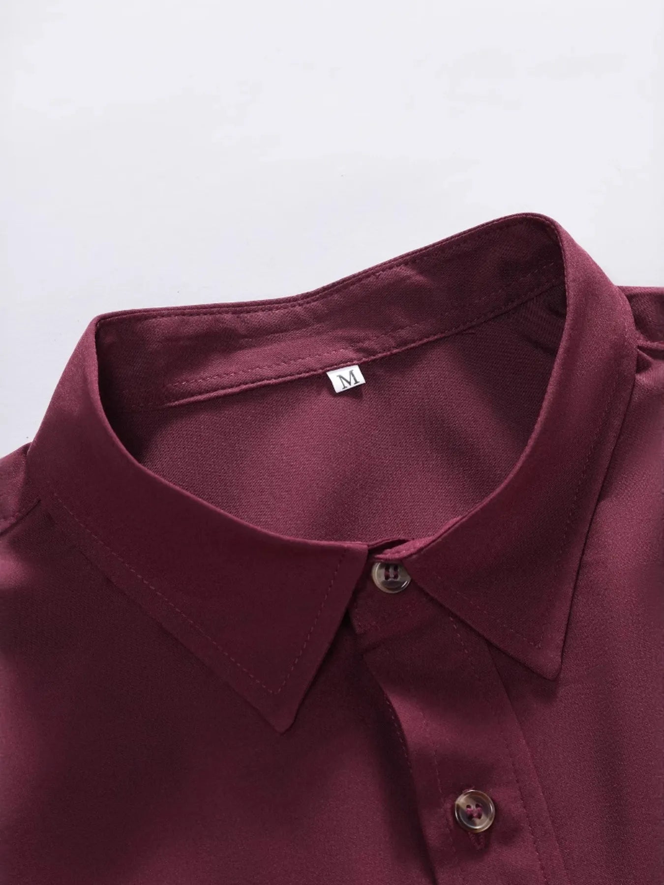 Detailed view of the sharp collar on the URBAN UNIT Foundation Short Sleeve Shirt in Oxblood Red. Showcasing the tailored edge that bridges professional discipline with raw street style.