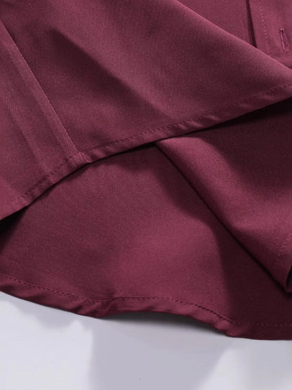 Close-up of the hem and fabric texture of the URBAN UNIT Foundation Short Sleeve Shirt. Emphasizing the clean finish and structured cotton blend designed to maintain its shape.