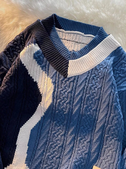 Close-up of the deep V-neck and heavy cable-knit texture on the URBAN UNIT Fracture Sweater in Deep Water Blue. Premium urban winter layering and structural design.
