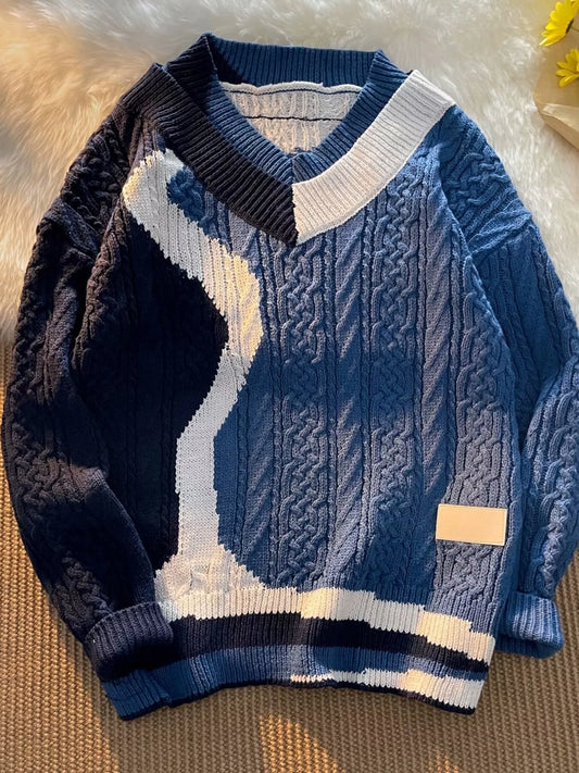 Deep Water Blue V-Neck Knit Sweater by URBAN UNIT featuring an asymmetrical white and navy color-block wave. Oversized streetwear cable-knit pullover for the urban grind.