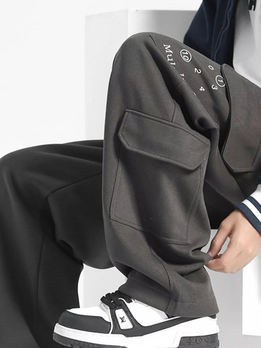 URBAN UNIT Multiple Star Loose Fit Cargo Pants in Asphalt Grey - Pocket and Graphic Detail