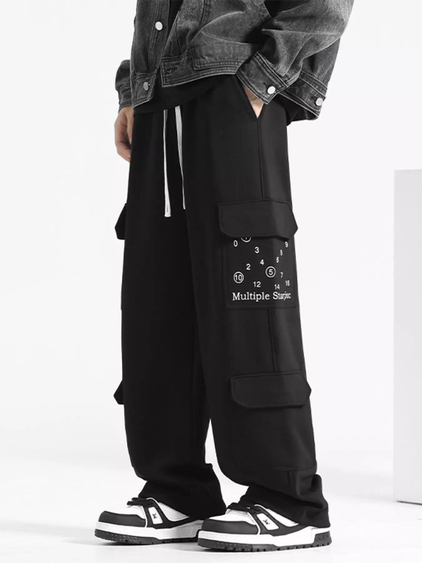URBAN UNIT Multiple Star Loose Fit Cargo Pants in Midnight Black - Full Side View