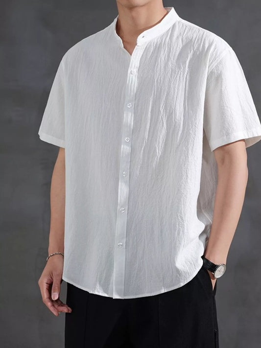 Model wearing the URBAN UNIT Origin Silhouette Mandarin Collar Shirt in Pure White. Premium oversized streetwear featuring a relaxed, plus-size optimized drape.
