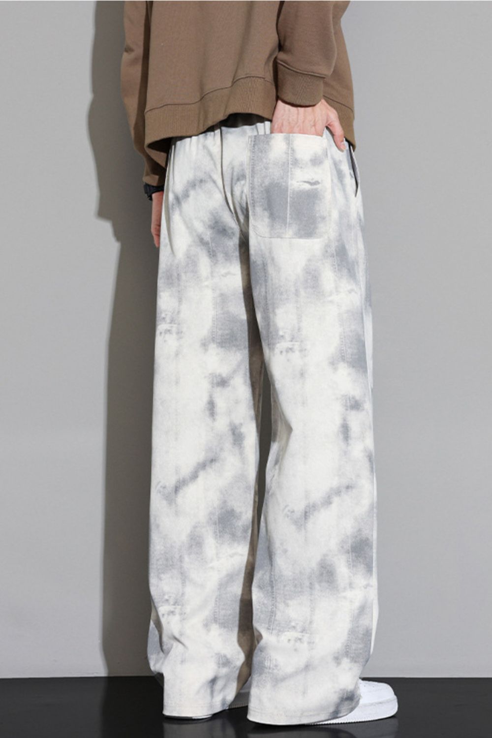 Back view of the URBAN UNIT Static Wash Pant in Concrete Static, featuring the back pocket design and continuous loose-fit silhouette.
