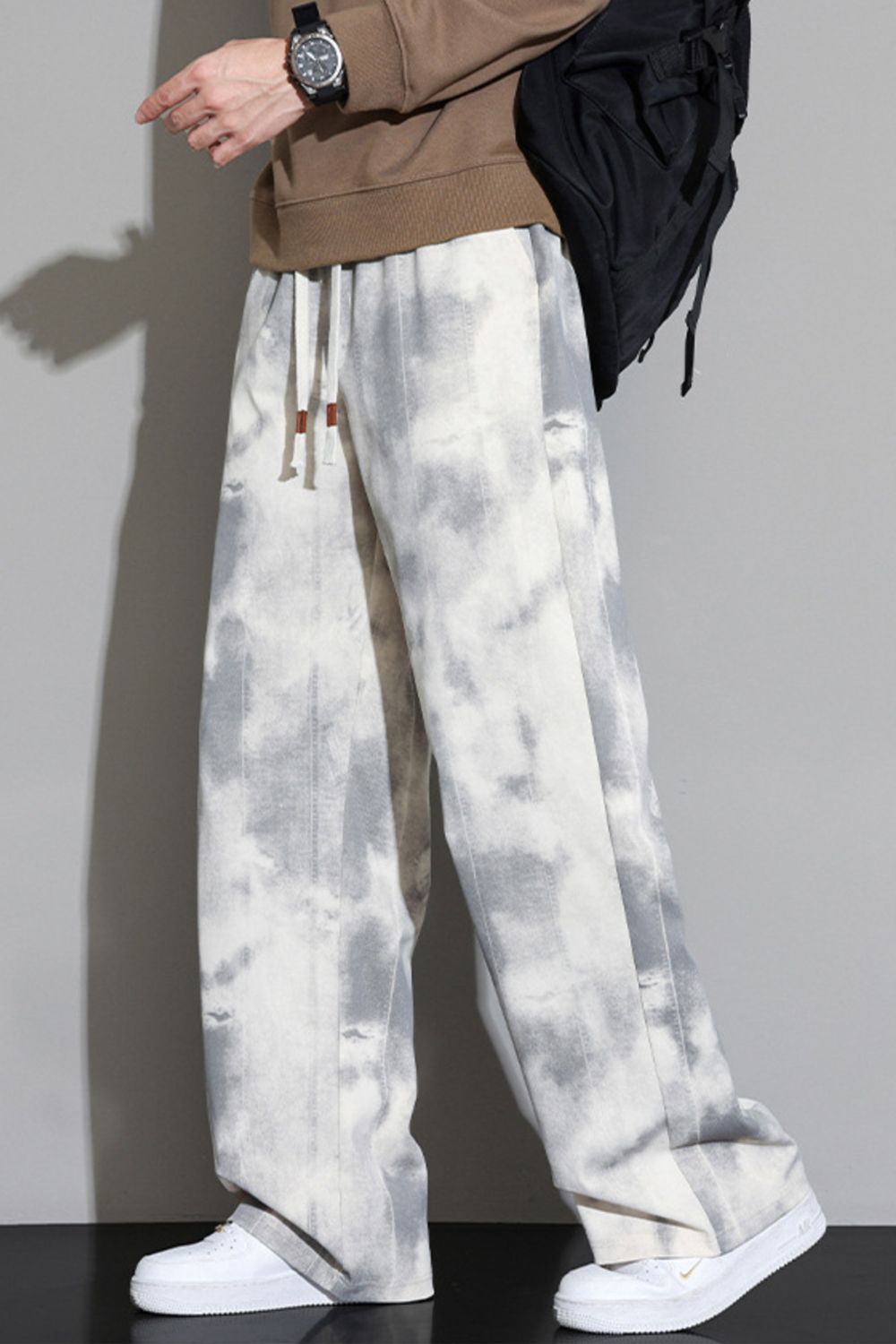 Model wearing the URBAN UNIT Static Wash Tie-Dye Pant in Concrete Static, highlighting the wide-leg oversized drape and raw urban aesthetic.