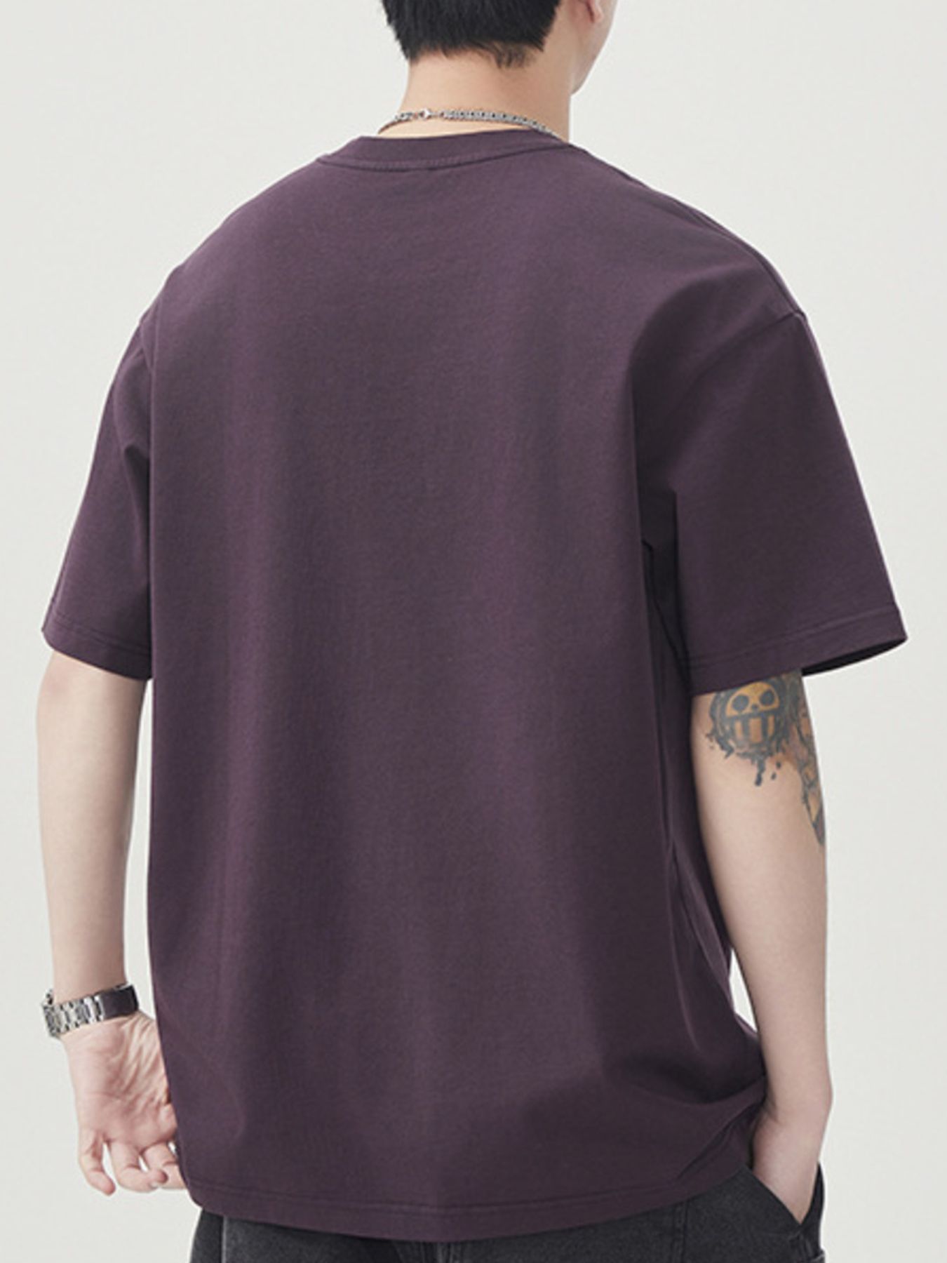 Back view of the URBAN UNIT SUNDAY Origin Oversized Tee in Faded Plum, highlighting the structured, voluminous silhouette for urban environments.