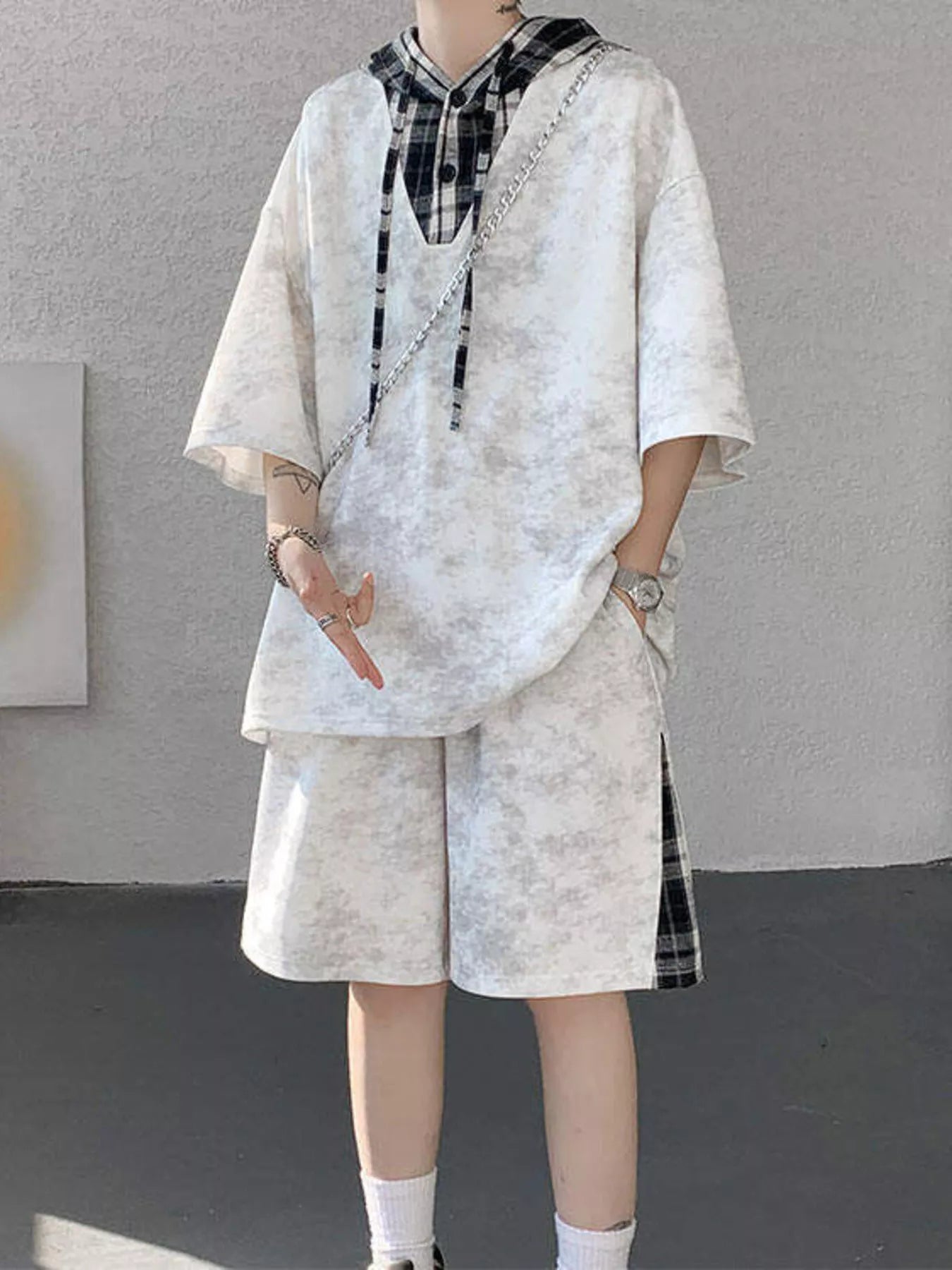 Model wearing the URBAN UNIT VANGUARD Layered Set in Concrete Ash, highlighting the loose-fit streetwear drape and faux-layered plaid details.