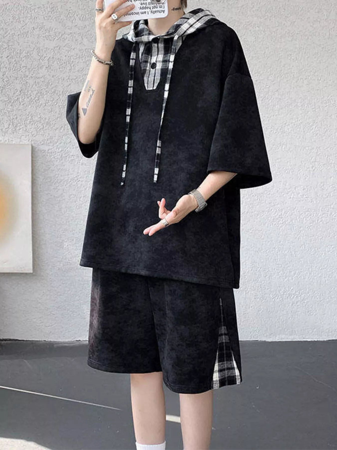 Streetwear model showcasing the URBAN UNIT VANGUARD Layered Set in Midnight Onyx, highlighting the resilient non-stretch fabric and wide-leg cut.