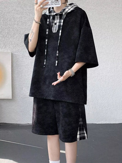 Streetwear model showcasing the URBAN UNIT VANGUARD Layered Set in Midnight Onyx, highlighting the resilient non-stretch fabric and wide-leg cut.