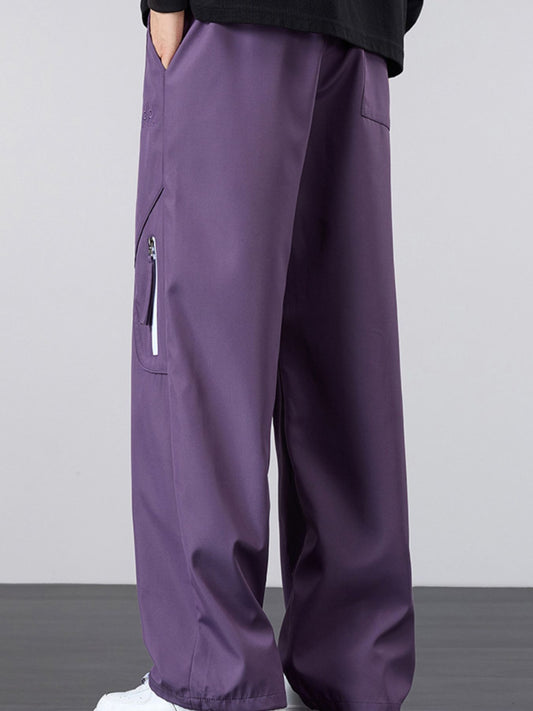 Close-up of the tactical zipper pocket and contrast pull on the UU Vector Zip Loose-Fit Cargo Pants in Shadow Violet by URBAN UNIT.
