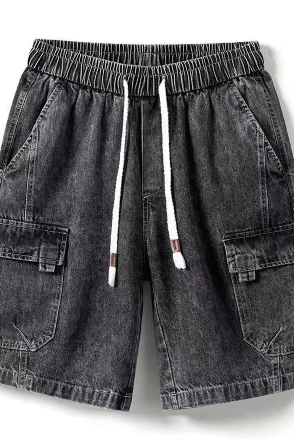 Front view of URBAN UNIT Vintage Wash Cargo Denim Shorts in Faded Obsidian. Highlighting the rugged dark denim texture, elastic waistband, and utility cargo pockets.