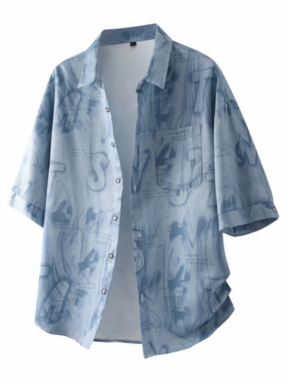 Glitch Blue Front: Front view of the URBAN UNIT Cipher Print Oversized Shirt in Glitch Blue, featuring a high-contrast abstract urban graphic and button-down design.