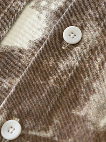 Close-up of the resilient cotton blend fabric and heavy-duty buttons on the URBAN UNIT Corrosion Oversized Shirt in Rust Terrain.