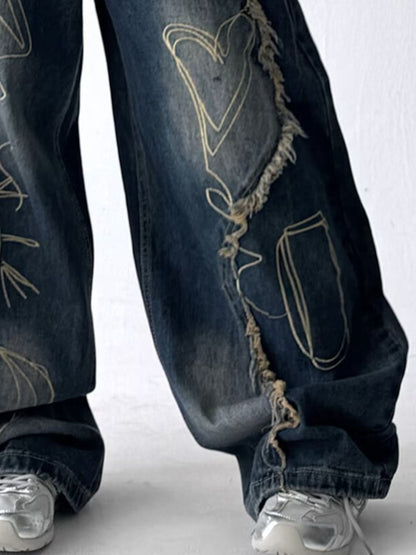 Close up of the ultra-wide leg drape and raw frayed seams on URBAN UNIT oversized streetwear jeans.