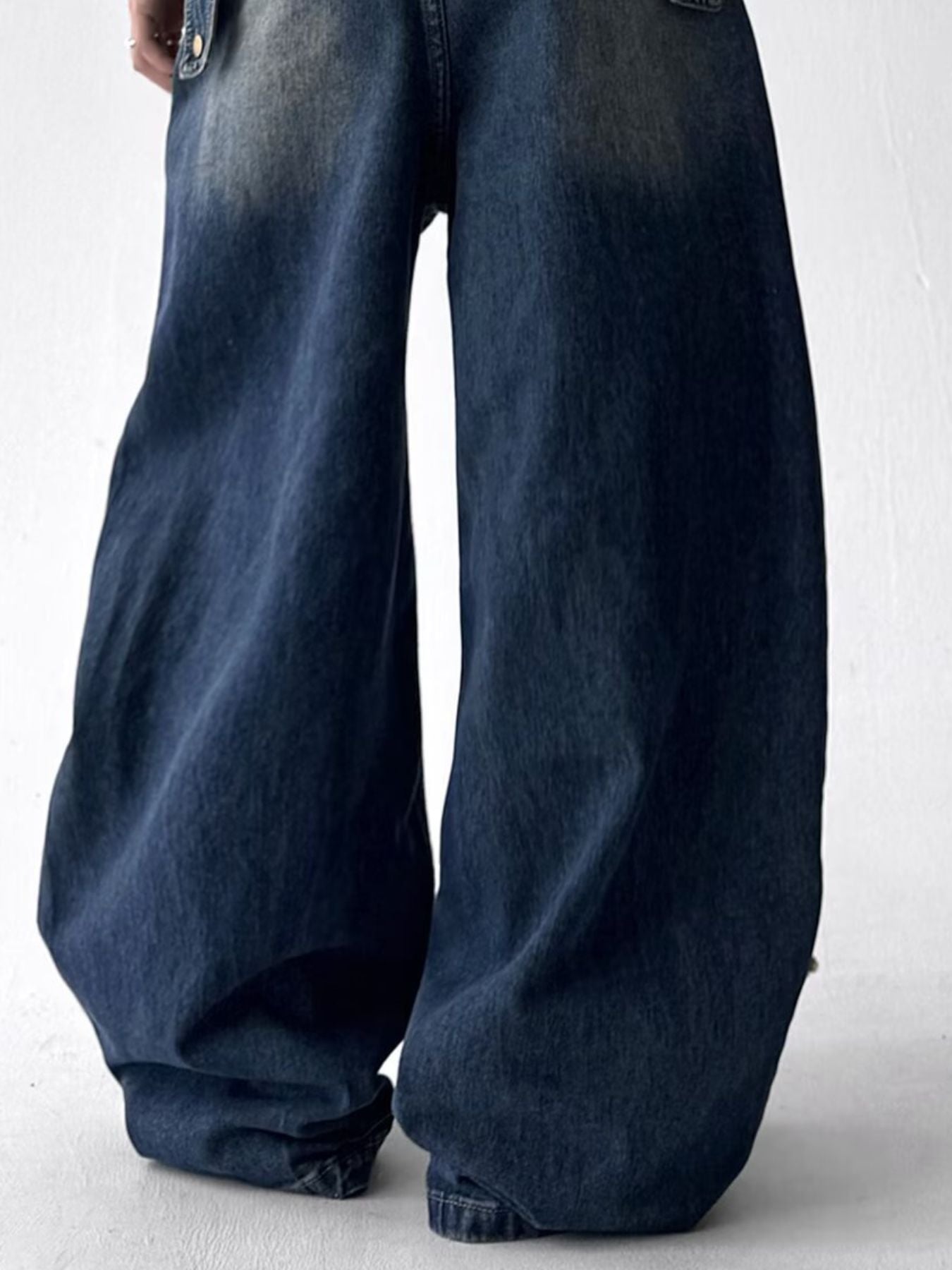 Side and back view of URBAN UNIT plus-size optimized denim showing maximum volume and structural drape.
