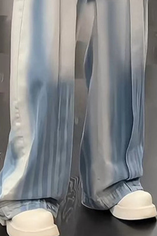 Close-up of the URBAN UNIT Gradient Wash Denim showcasing the wide-leg drape, raw blue fade, and structured fabric over chunky sneakers.