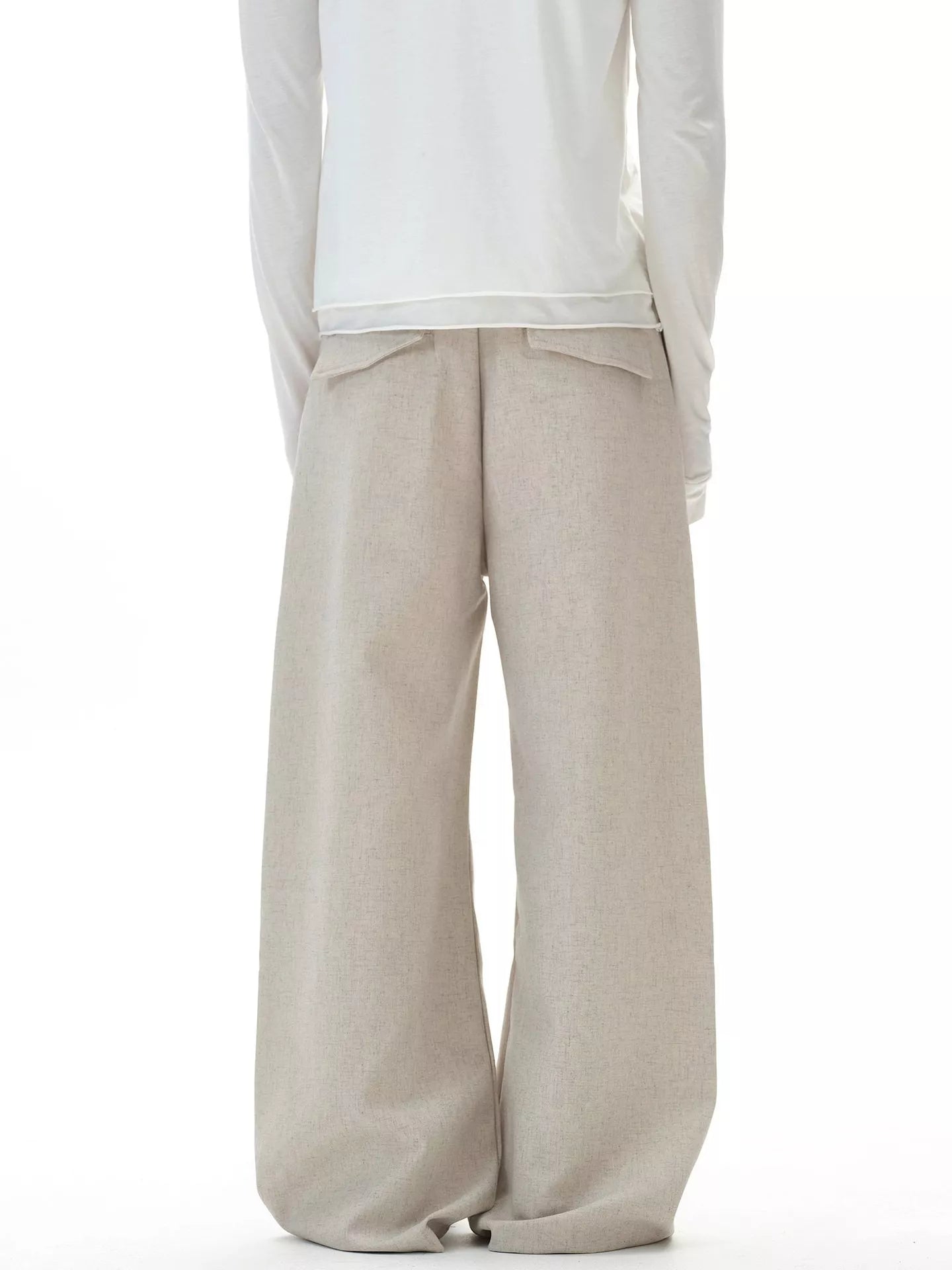 Back view of the URBAN UNIT Origin Silhouette Wide-Leg Trouser in Concrete Sand, displaying the clean, wide-leg structure and relaxed urban fit.