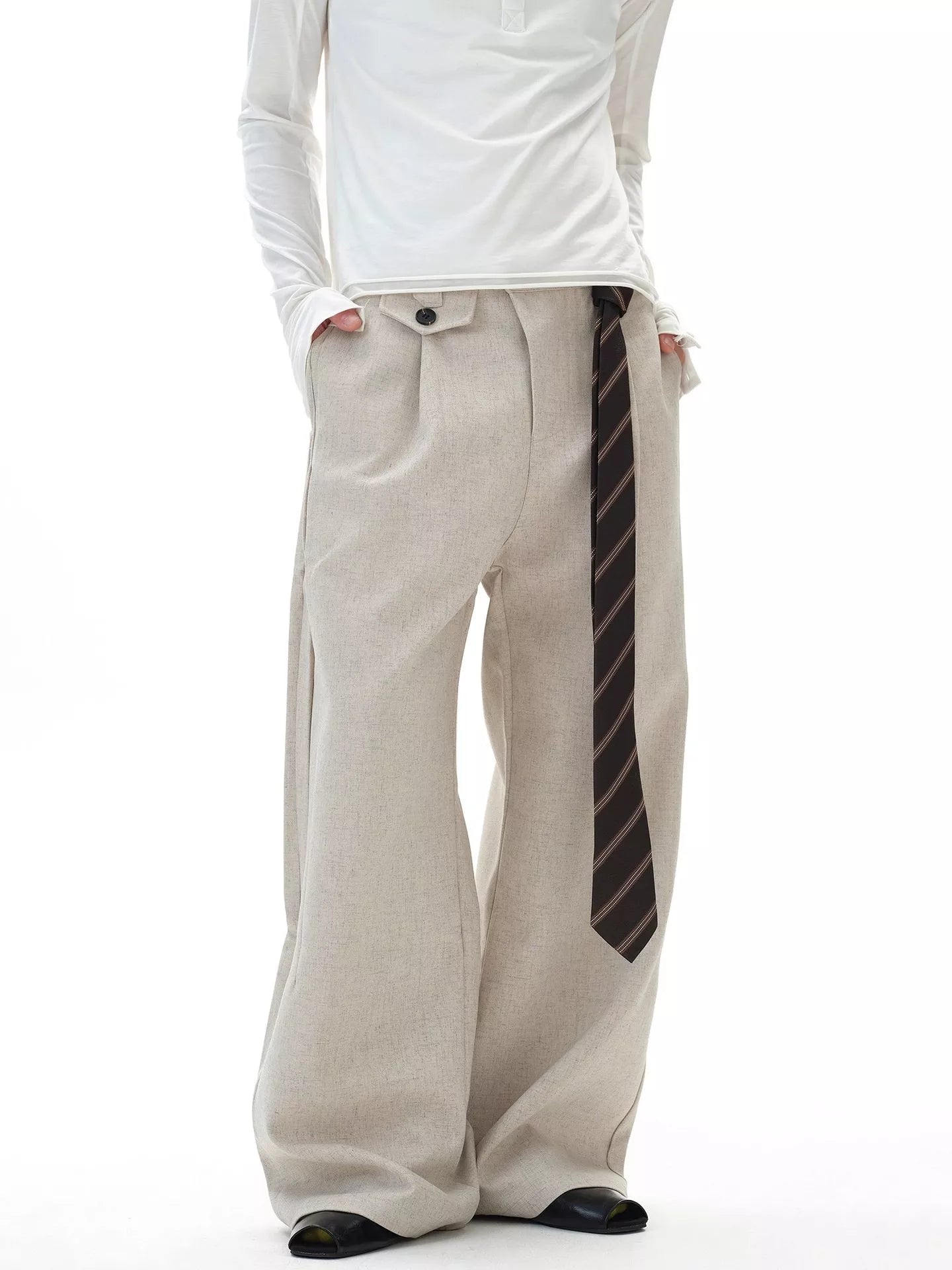 Front view of the URBAN UNIT Origin Silhouette Wide-Leg Trouser in Concrete Sand, showcasing the oversized drape and extended statement belt for a premium streetwear look.
