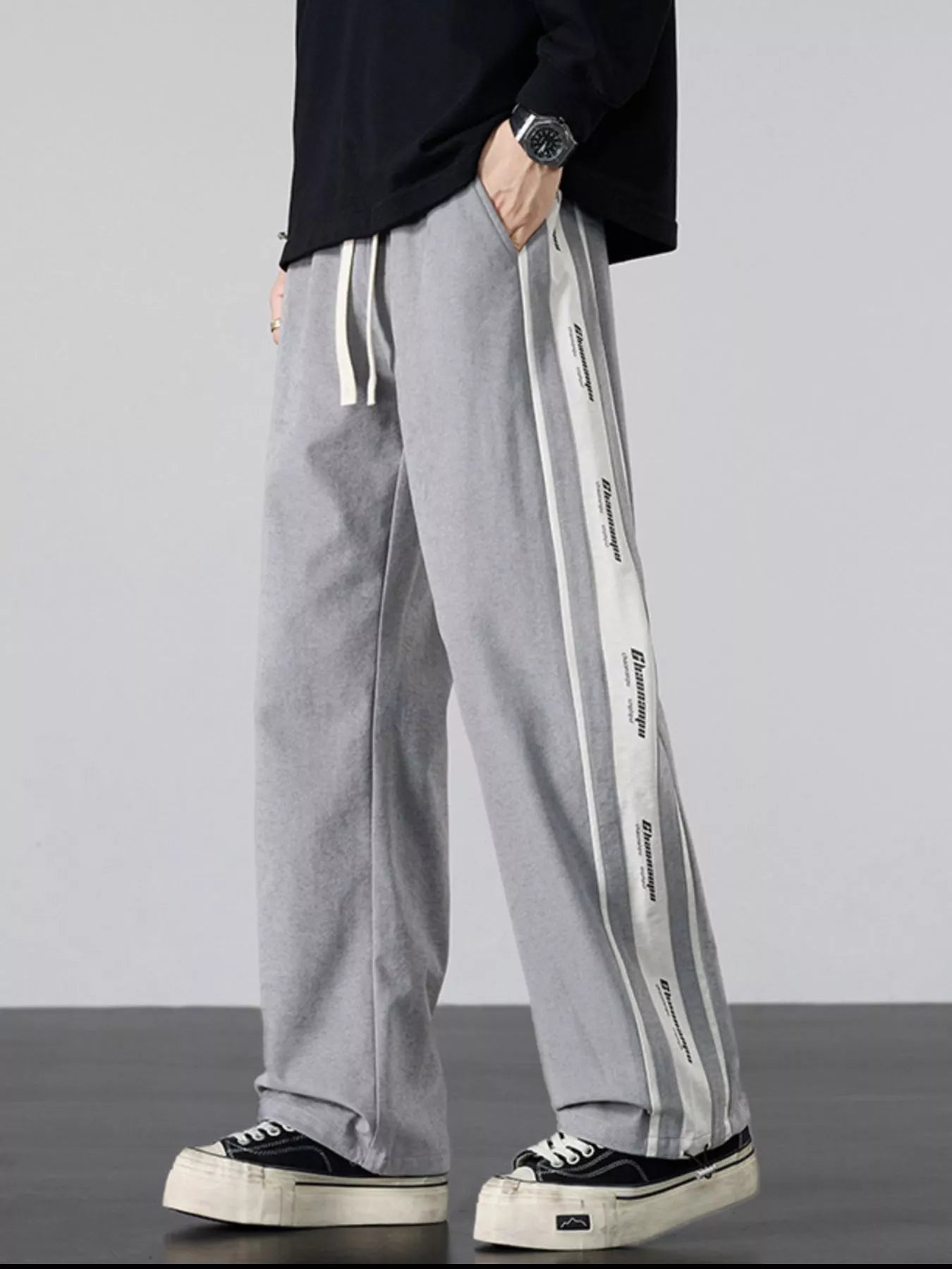 Angled view of the grey silhouette focusing on fabric drape.