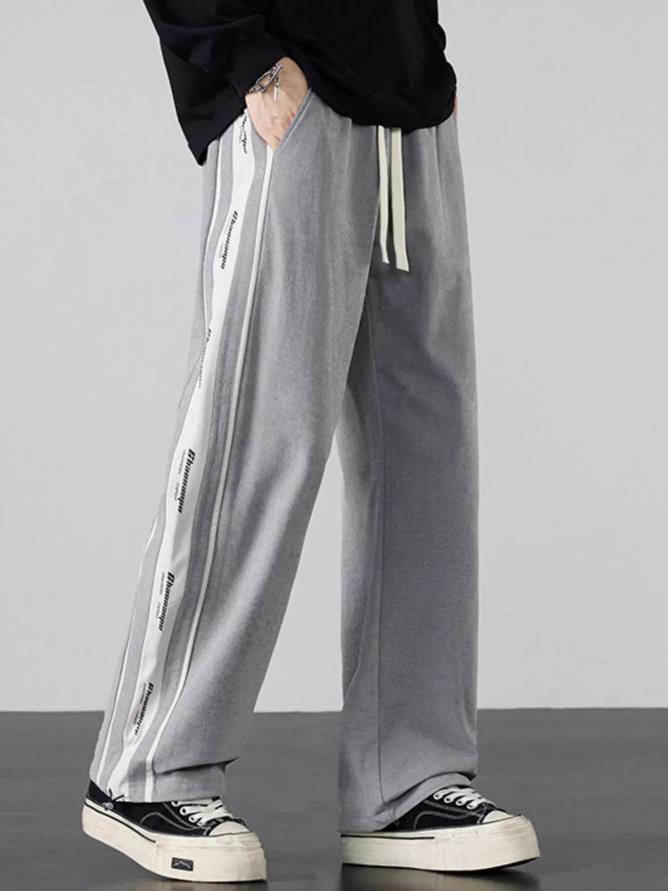 Full front profile of the grey wide-leg cargo pants.
