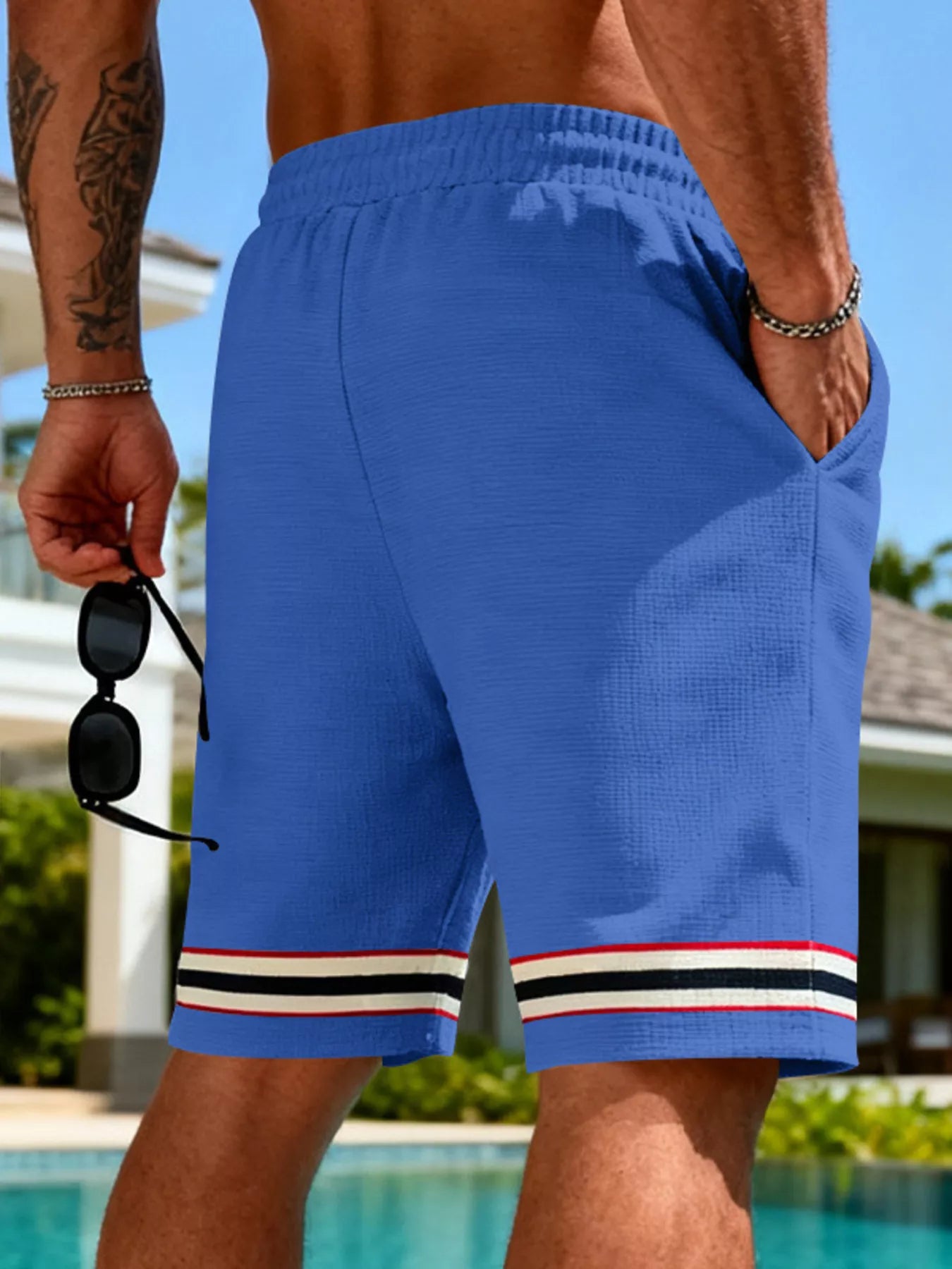 Back view of the URBAN UNIT Sector Silhouette Knit Shorts in Electric Blue, highlighting the oversized fit and structured drop designed for maximum mobility.