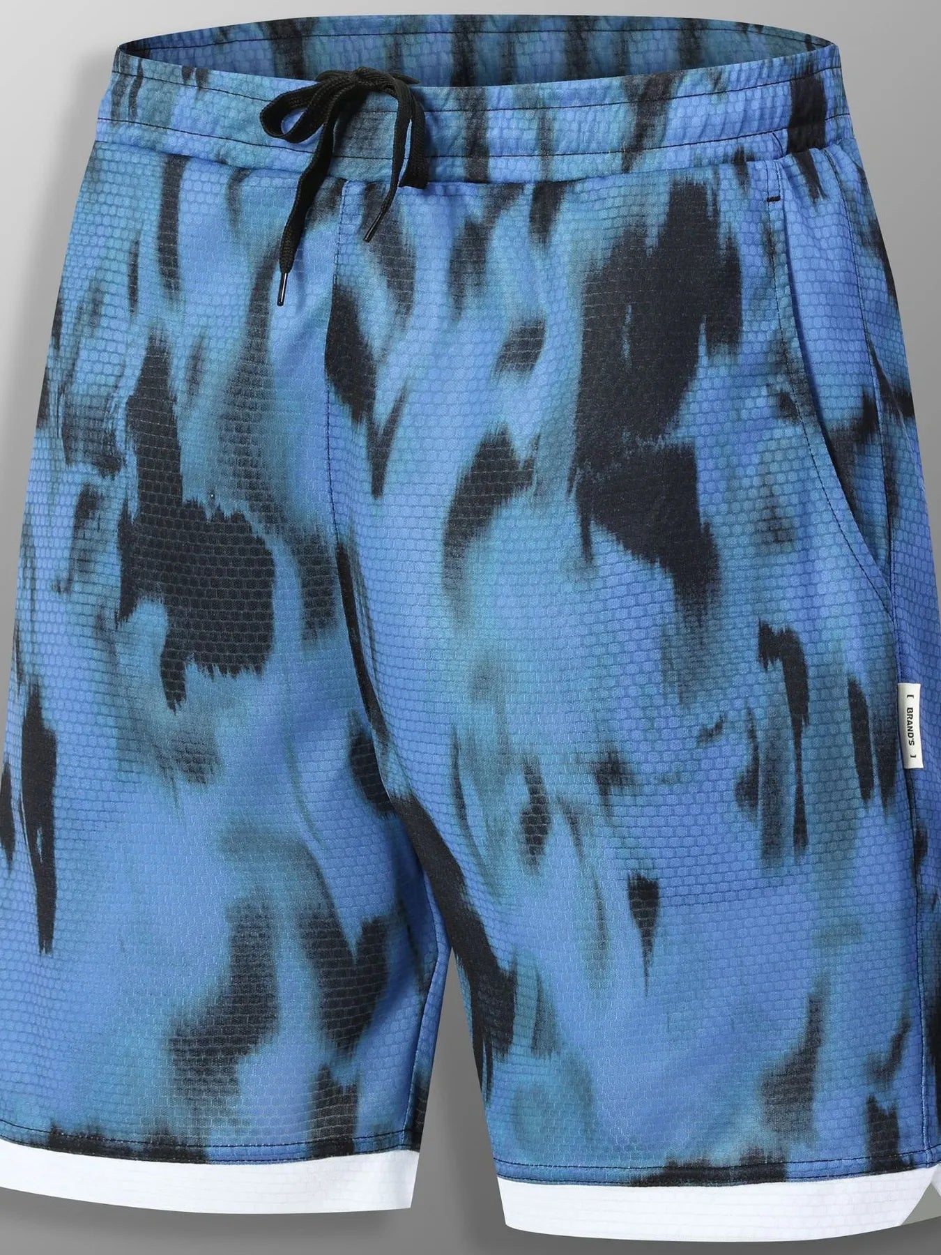 URBAN UNIT SHIFT Tie-Dye Active Shorts in Midnight Blue Distortion. Front view showcasing the high-voltage blue and black pattern with a high-contrast white hem.