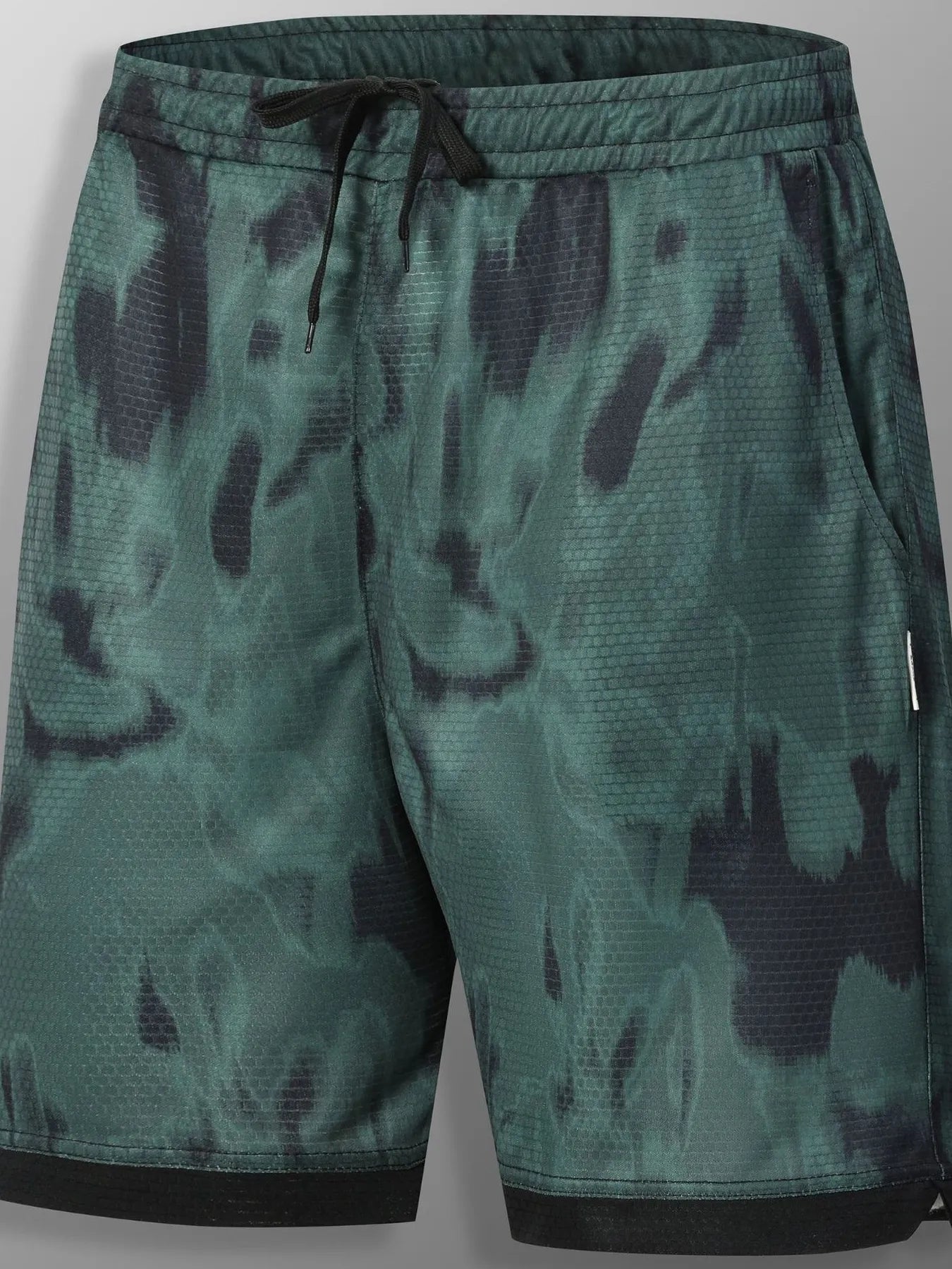 URBAN UNIT SHIFT Tie-Dye Active Shorts in Toxic Lime Shadow. Front view displaying the bold green and black distressed street aesthetic with a dark contrasting hem.
