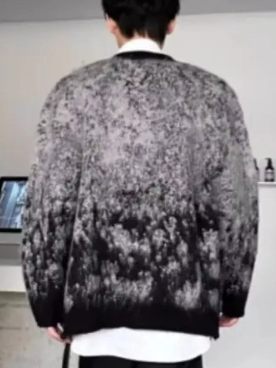 Back view of the URBAN UNIT Static Gradient Cardigan. Showing the full transition from ash grey at the shoulders down to the midnight black hem.
