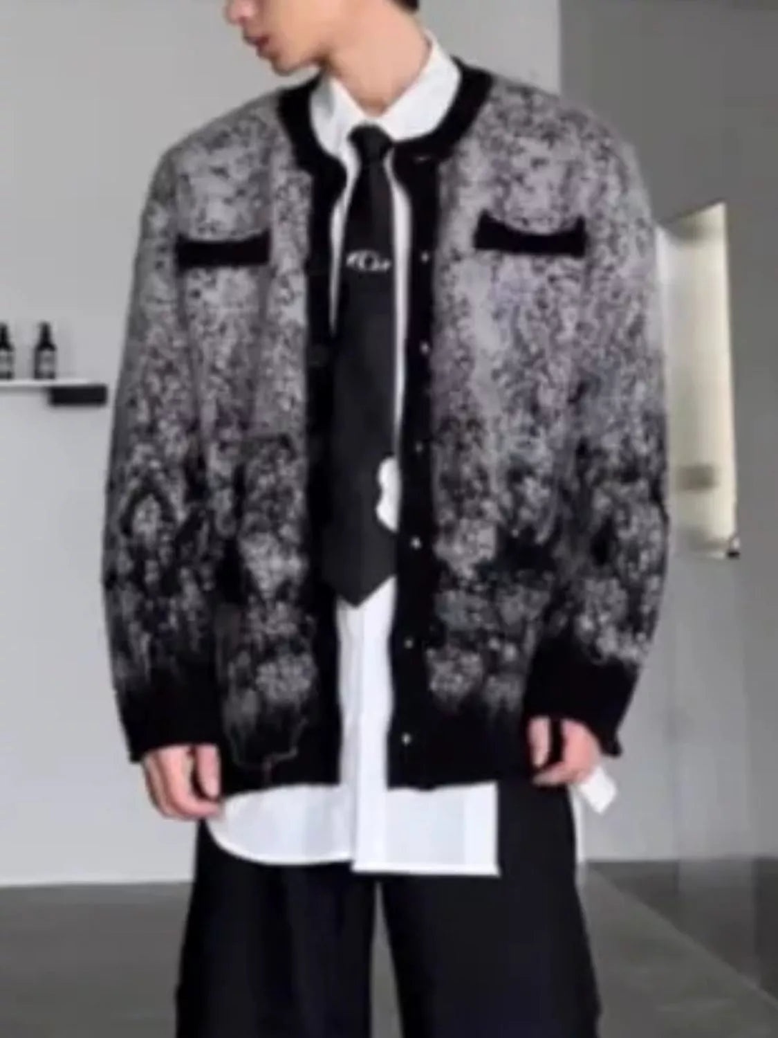Model wearing the URBAN UNIT Static Gradient Cardigan open over a white shirt. Displaying the structured drape, oversized silhouette, and black bottom hem.