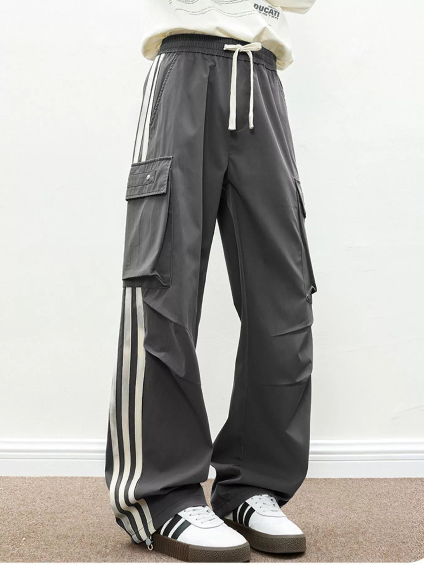 Back view of the UU Vanguard Cargo in Graphite Stealth highlighting the voluminous streetwear silhouette.