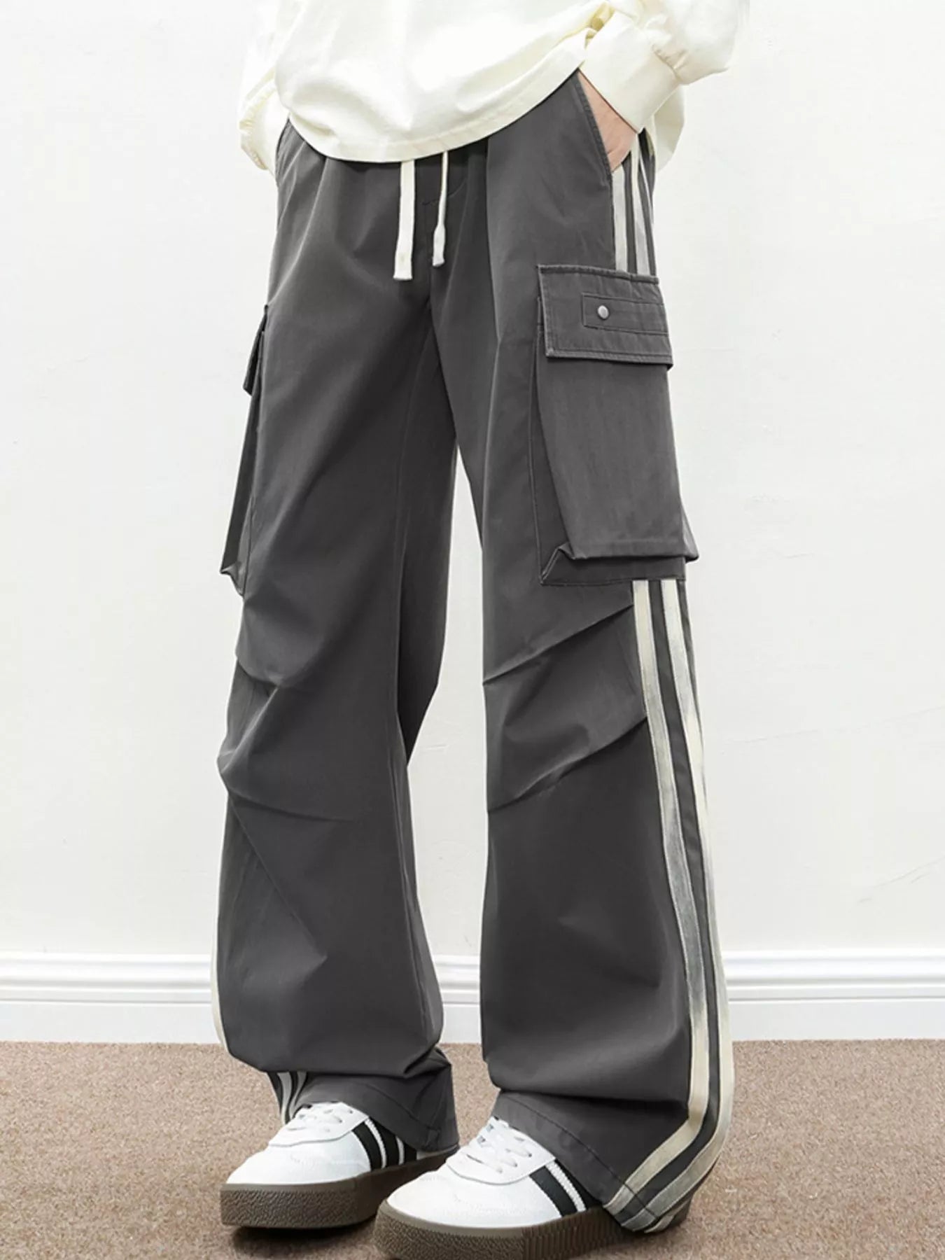 Urban Unit Vanguard Silhouette Wide-Leg Cargo Pants in Graphite Stealth featuring high-contrast side stripes.