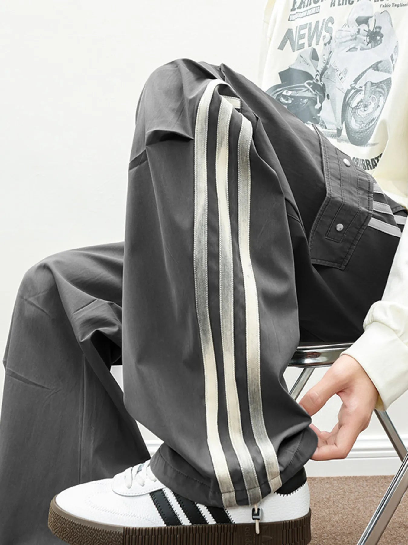 Close-up of the triple side-stripes and industrial fabric of the Graphite Stealth Vanguard Cargo pants.